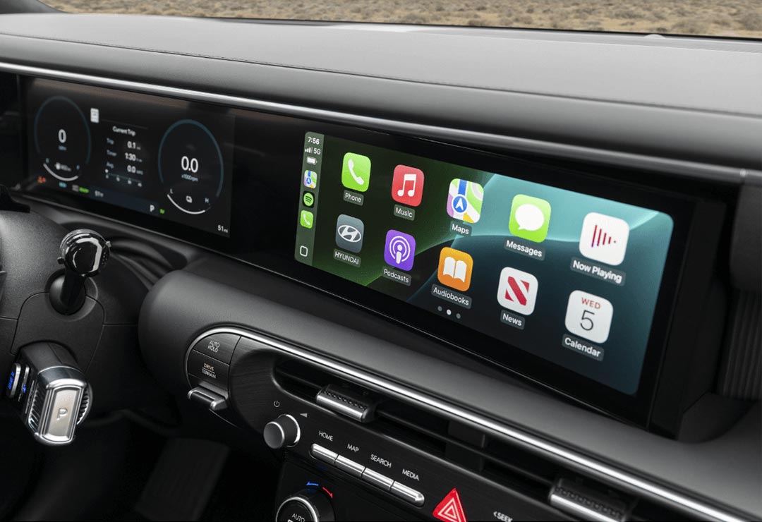 Intérieur du Hyundai Palisade avec écran panoramique incurvé et tableau de bord numérique.
